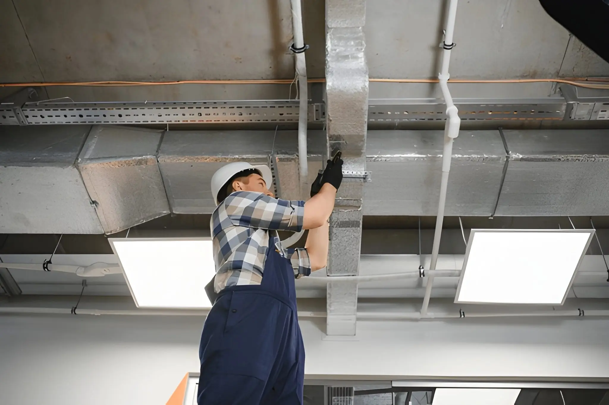 HVAC technician installing new duct system for better airflow and energy efficiency
